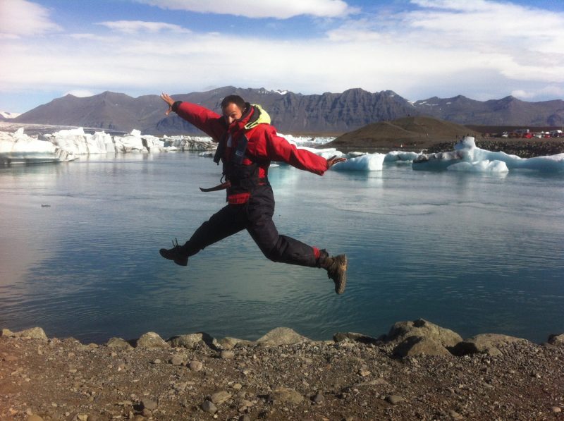Man-jumping-in-glacier-lake-iceland